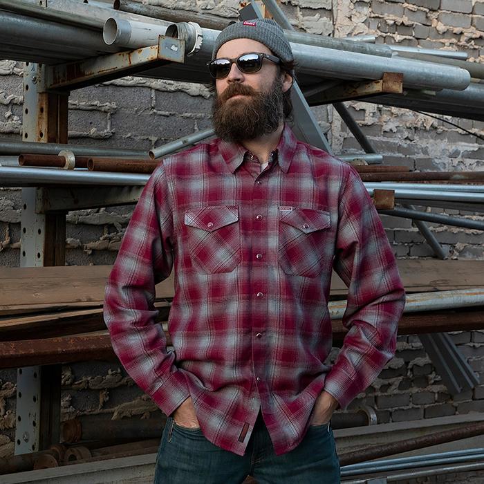 man wearing dixxon pinot flannel shirt standing